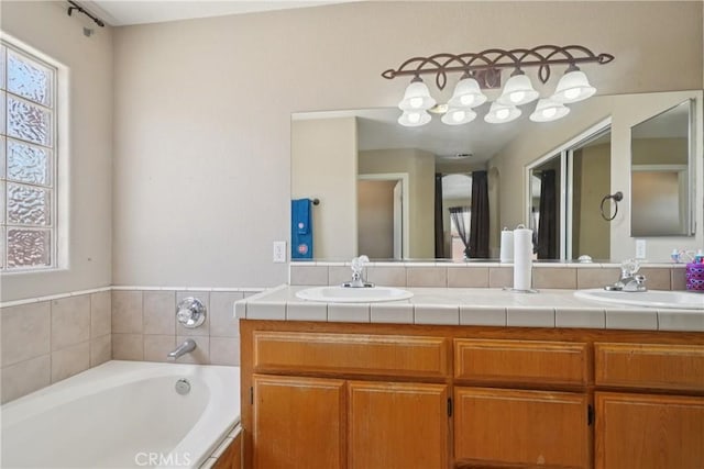 12671 Shorewood Ln, Victorville, CA 92392 - full bath with plenty of natural light, double vanity, and a garden tub