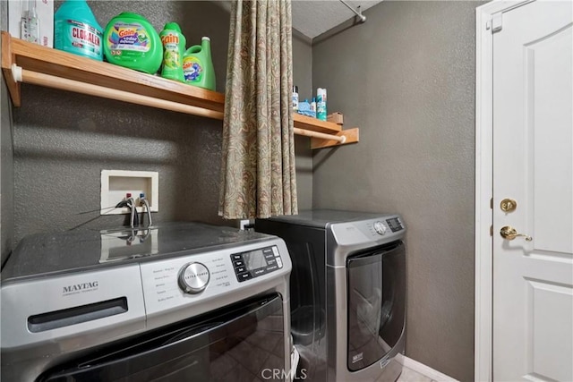 12671 Shorewood Ln, Victorville, CA 92392 - laundry area with washing machine and dryer and a textured wall