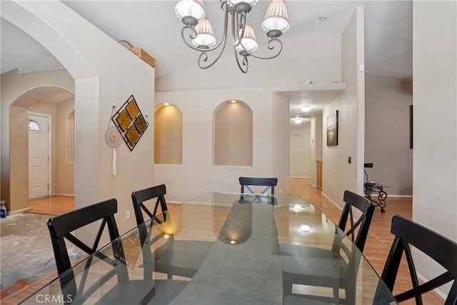 12671 Shorewood Ln, Victorville, CA 92392 - dining room featuring arched walkways and a chandelier
