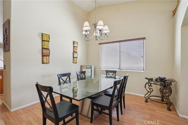 12671 Shorewood Ln, Victorville, CA 92392 - dining area featuring light wood-type flooring, a chandelier, and lofted ceiling