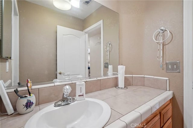 12671 Shorewood Ln, Victorville, CA 92392 - bathroom with vanity and a textured wall