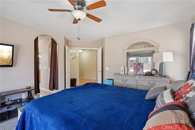 12671 Shorewood Ln, Victorville, CA 92392 - bedroom with arched walkways and ceiling fan