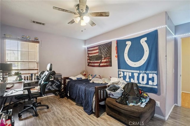 12671 Shorewood Ln, Victorville, CA 92392 - bedroom featuring wood finished floors, a desk, and ceiling fan