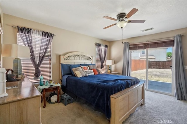 12671 Shorewood Ln, Victorville, CA 92392 - carpeted bedroom with access to exterior and a ceiling fan