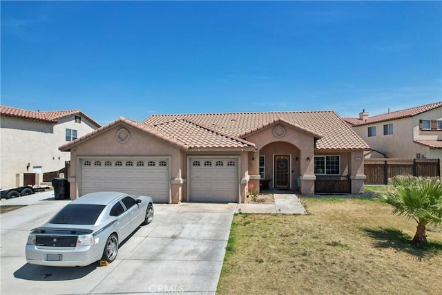 12671 Shorewood Ln, Victorville, CA 92392 - mediterranean / spanish house featuring an attached garage, stucco siding, a tiled roof, and concrete driveway