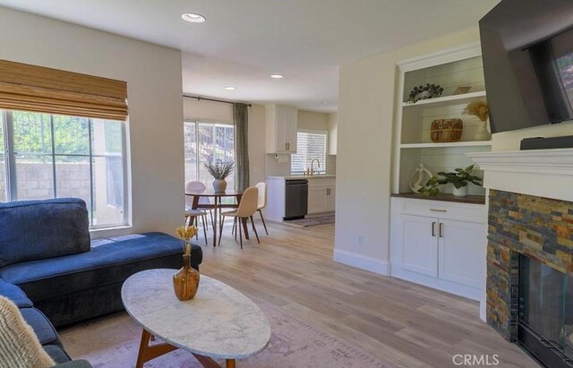 15 Parisville, Aliso Viejo, CA 92656 - living room featuring a fireplace, light wood-style flooring, and recessed lighting