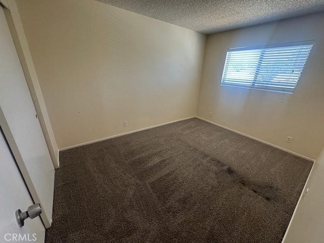 1848 Horizon Ln, Lancaster, CA 93535 - spare room featuring a textured ceiling and dark carpet