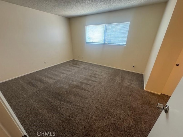 1848 Horizon Ln, Lancaster, CA 93535 - unfurnished room featuring a textured ceiling and dark carpet