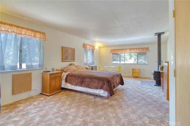 960 Snowbird Rd, Wrightwood, CA 92397 - bedroom featuring a wood stove and light carpet