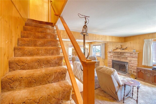 960 Snowbird Rd, Wrightwood, CA 92397 - stairs featuring wood walls, carpet flooring, and a fireplace
