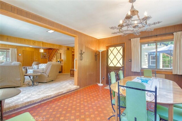 960 Snowbird Rd, Wrightwood, CA 92397 - dining room featuring wood walls and a chandelier