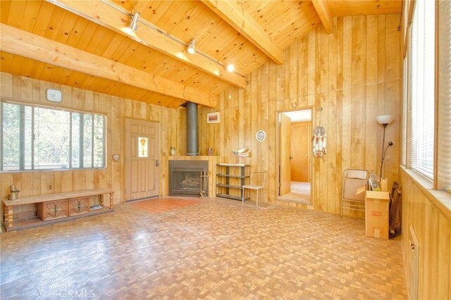 960 Snowbird Rd, Wrightwood, CA 92397 - unfurnished living room featuring wooden walls, plenty of natural light, wood ceiling, and rail lighting