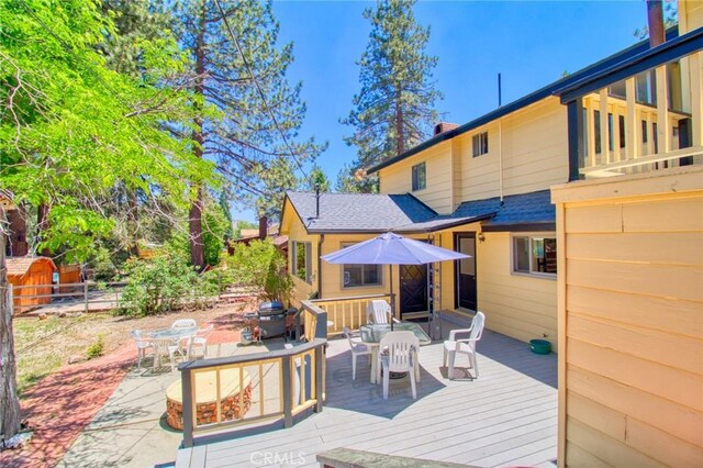 960 Snowbird Rd, Wrightwood, CA 92397 - wooden deck with outdoor dining space and area for grilling