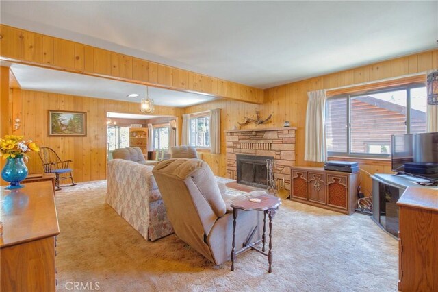 960 Snowbird Rd, Wrightwood, CA 92397 - living area with light carpet, wood walls, and a fireplace