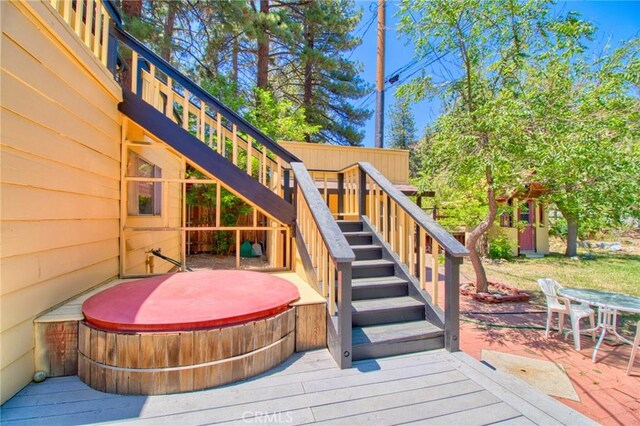 960 Snowbird Rd, Wrightwood, CA 92397 - deck featuring a covered hot tub, stairway, a patio area, and outdoor dining space