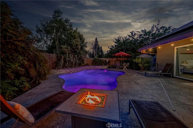 3486 Cascade Creek Ave, Merced, CA 95340 - view of swimming pool with a fire pit, a patio, and a fenced backyard