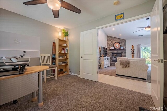 3486 Cascade Creek Ave, Merced, CA 95340 - home office with a ceiling fan, carpet flooring, and a stone fireplace