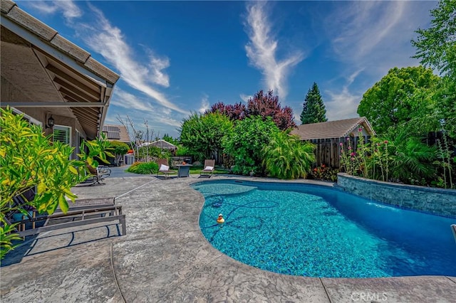 3486 Cascade Creek Ave, Merced, CA 95340 - swimming pool with a patio and a fenced backyard