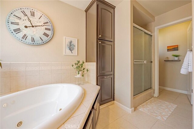 3486 Cascade Creek Ave, Merced, CA 95340 - full bath featuring a shower stall, a whirlpool tub, and tile patterned floors