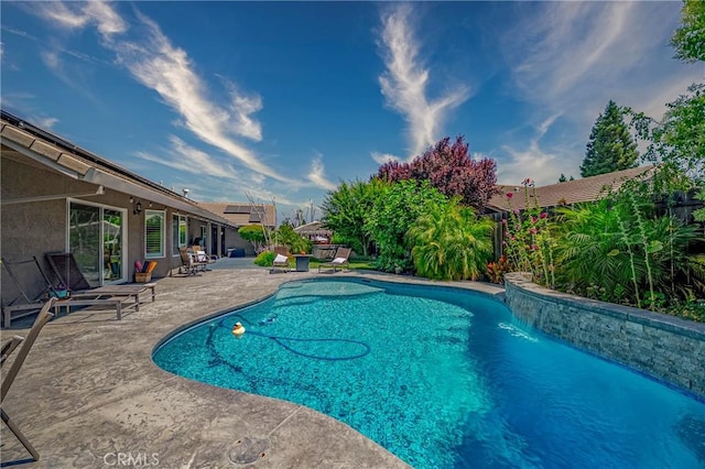 3486 Cascade Creek Ave, Merced, CA 95340 - swimming pool with a patio and a fenced backyard