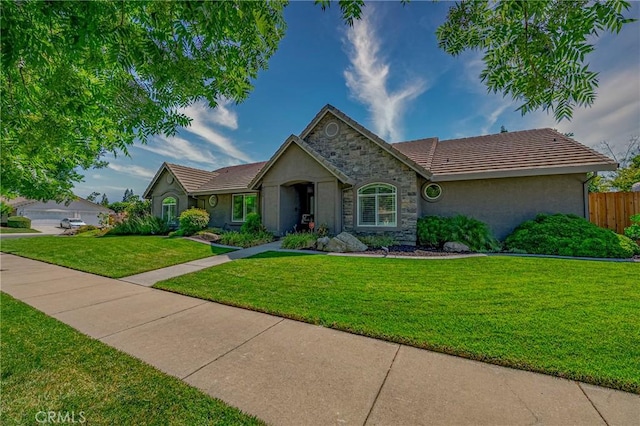 3486 Cascade Creek Ave, Merced, CA 95340 - single story home with stone siding, stucco siding, and a tile roof