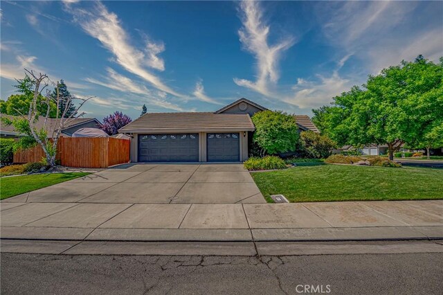 3486 Cascade Creek Ave, Merced, CA 95340 - view of front facade featuring concrete driveway, a tile roof, and a garage