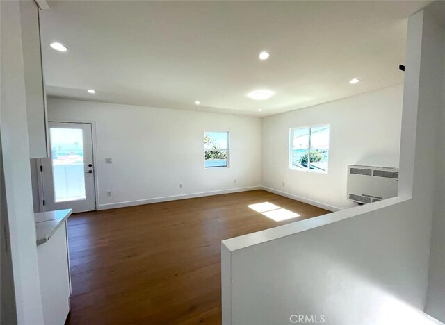 624 W 38th St, San Pedro, CA 90731 - empty room featuring radiator, dark wood-type flooring, and recessed lighting