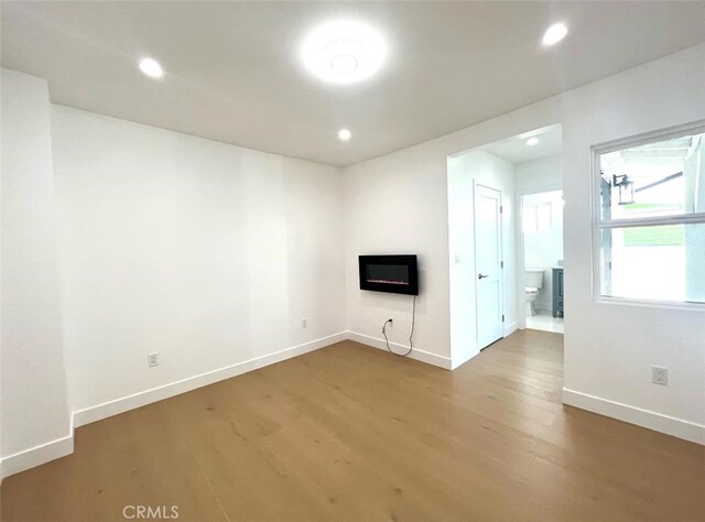 624 W 38th St, San Pedro, CA 90731 - unfurnished living room with wood finished floors, a fireplace, and recessed lighting
