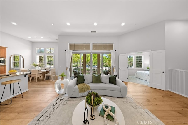83 City Stroll, Irvine, CA 92620 - living area featuring light wood finished floors, recessed lighting, and plenty of natural light