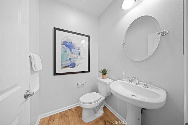 83 City Stroll, Irvine, CA 92620 - half bathroom with wood finished floors and toilet