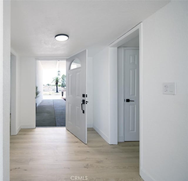 14163 Wimbleton Dr, Victorville, CA 92395 - foyer entrance featuring baseboards and light wood finished floors