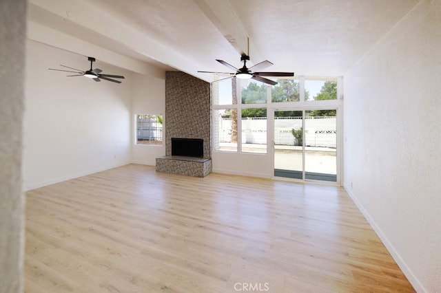 14163 Wimbleton Dr, Victorville, CA 92395 - unfurnished living room featuring healthy amount of natural light, light wood-type flooring, ceiling fan, and lofted ceiling