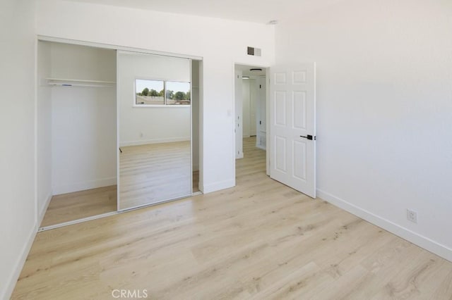 14163 Wimbleton Dr, Victorville, CA 92395 - unfurnished bedroom with a closet and wood finished floors