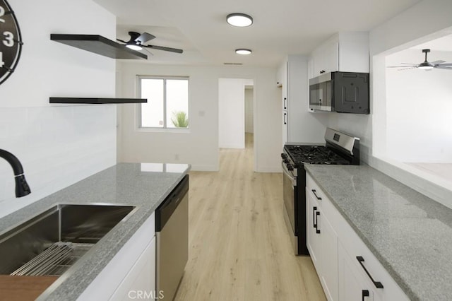 14163 Wimbleton Dr, Victorville, CA 92395 - kitchen with stainless steel appliances, a ceiling fan, light wood finished floors, and light stone counters