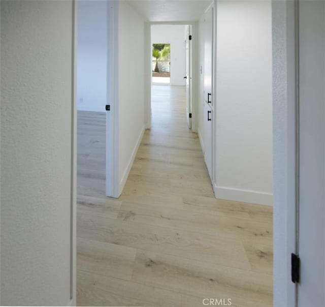 14163 Wimbleton Dr, Victorville, CA 92395 - corridor featuring light wood finished floors and baseboards