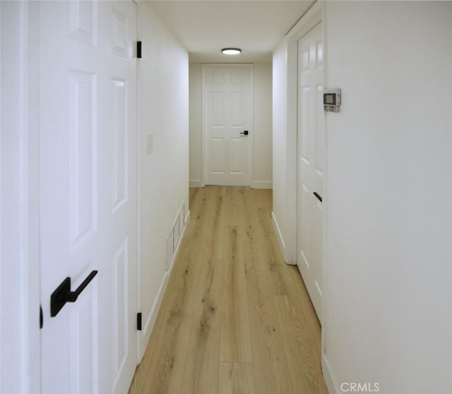 14163 Wimbleton Dr, Victorville, CA 92395 - corridor with light wood finished floors and baseboards