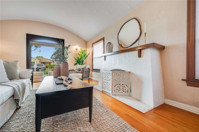5855 Lemon Ave, Long Beach, CA 90805 - living area featuring plenty of natural light, wood finished floors, and vaulted ceiling