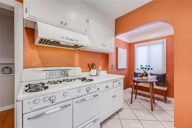 5855 Lemon Ave, Long Beach, CA 90805 - kitchen featuring white range with gas cooktop, under cabinet range hood, white cabinetry, light countertops, and light tile patterned floors