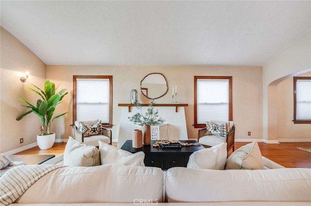 5855 Lemon Ave, Long Beach, CA 90805 - living room with arched walkways and wood finished floors