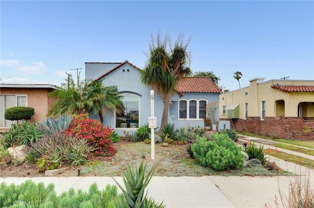 5855 Lemon Ave, Long Beach, CA 90805 - mediterranean / spanish house with stucco siding and a tile roof