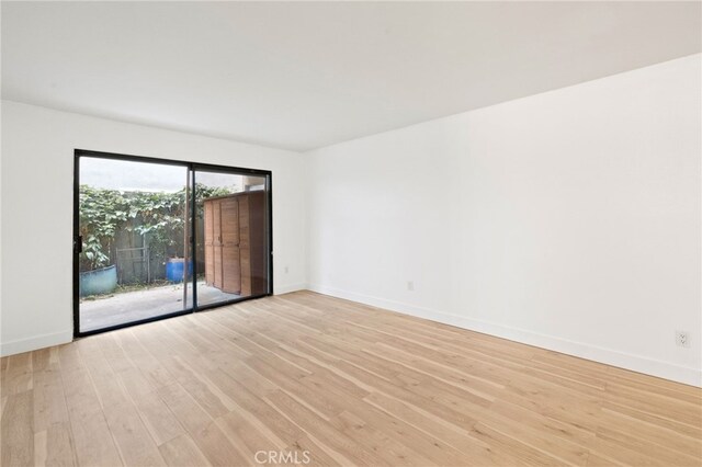 4647 Pico St Unit 101, San Diego, CA 92109 - empty room with light wood-style floors and baseboards