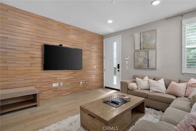 10554 Cannon Dr, Rancho Cucamonga, CA 91730 - living room with recessed lighting, wood finished floors, wood walls, and an accent wall