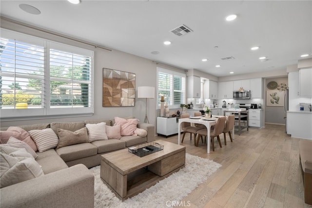 10554 Cannon Dr, Rancho Cucamonga, CA 91730 - living area with light wood-style flooring and recessed lighting