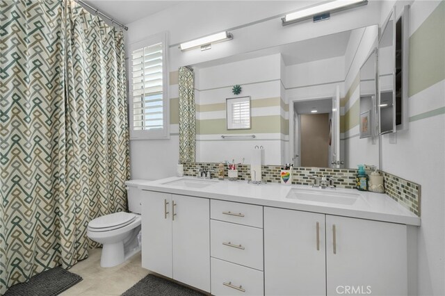 10554 Cannon Dr, Rancho Cucamonga, CA 91730 - bathroom featuring tasteful backsplash, double vanity, and curtained shower