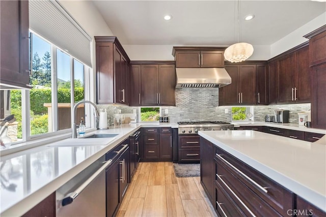 949 Moody Pl, Claremont, CA 91711 - kitchen featuring exhaust hood, plenty of natural light, light countertops, dishwasher, and recessed lighting