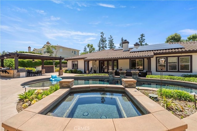 949 Moody Pl, Claremont, CA 91711 - outdoor pool featuring an in-ground hot tub, exterior kitchen, a patio area, and an outdoor hangout area