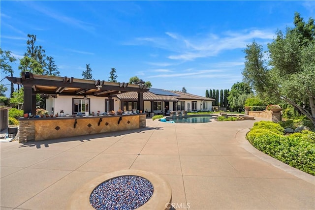 949 Moody Pl, Claremont, CA 91711 - back of house featuring an outdoor pool, a patio area, stucco siding, and solar panels