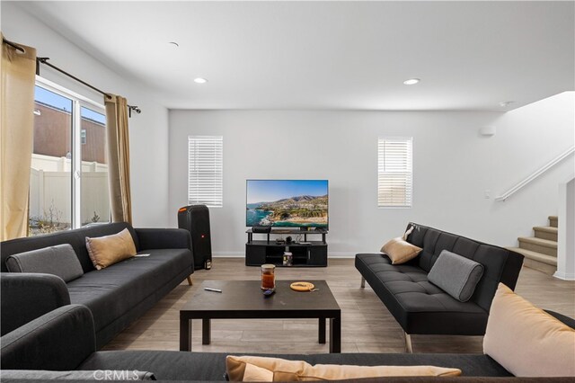20225 Breeze Blooms Dr, Riverside, CA 92507 - living room featuring healthy amount of natural light, recessed lighting, stairway, and light wood-type flooring