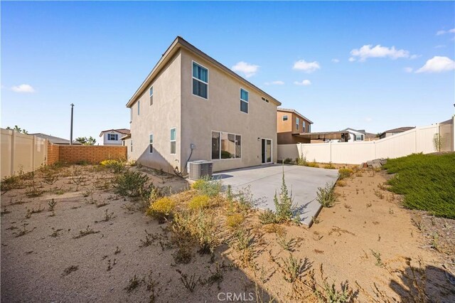 20225 Breeze Blooms Dr, Riverside, CA 92507 - back of property with a patio, a fenced backyard, and stucco siding