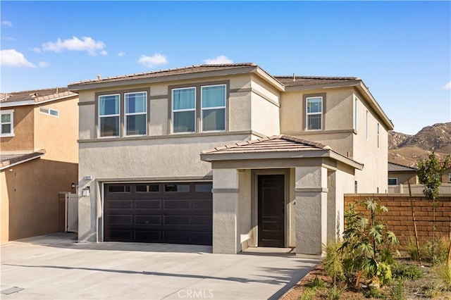 20225 Breeze Blooms Dr, Riverside, CA 92507 - view of front of house featuring an attached garage, concrete driveway, stucco siding, and a tiled roof